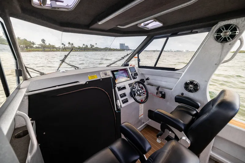 Slide: The Image of Interior of a 2022 Sealegs 8.5M boat with modern controls and seating. - 21