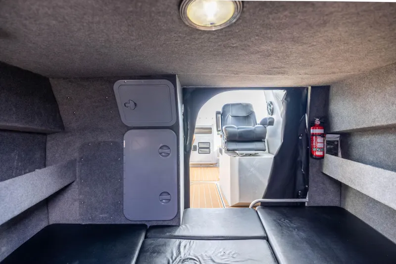 Slide: The Image of Interior of 2022 Sealegs 8.5M boat, featuring seating and storage compartments. - 22