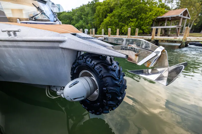 Slide: The Image of Amphibious Sealegs 8.5M boat with retractable wheels, 2022 model, near a dock. - 24