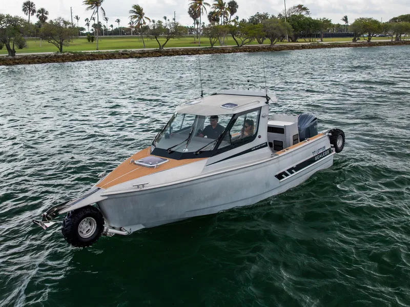 Slide: The Image of 2022 Sealegs 8.5M amphibious boat on water, featuring sleek design and modern technology. - 29