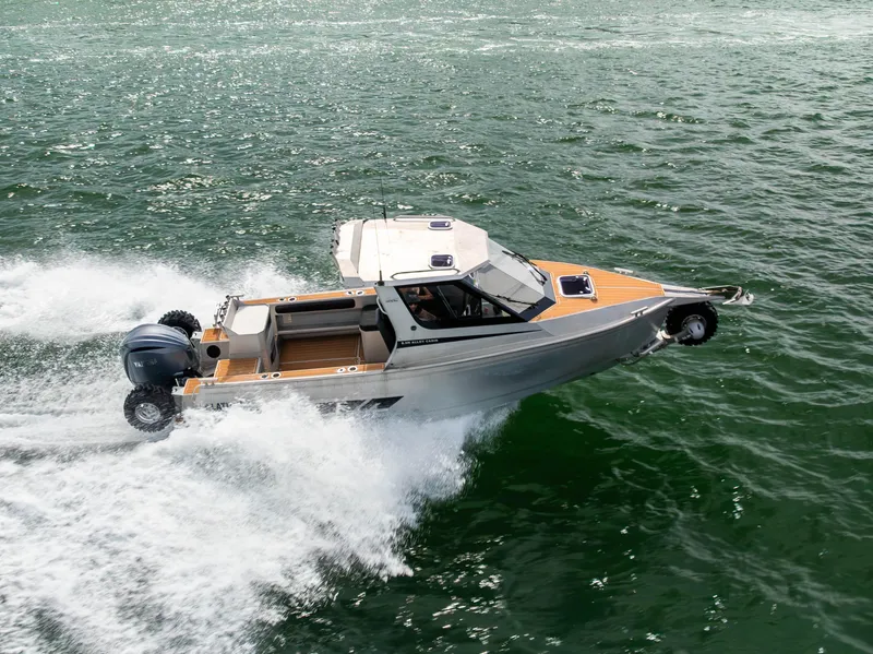 Slide: The Image of 2022 Sealegs 8.5M amphibious boat cruising on water, showcasing speed and versatility. - 3