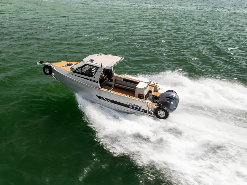 Slide: The Image of 2022 Sealegs 8.5M amphibious boat cruising on water, showcasing speed and versatility. - 32