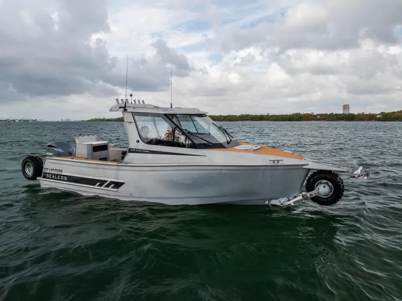 Slide: The Image of 2022 Sealegs 8.5M amphibious boat on water, cloudy sky background. - 5