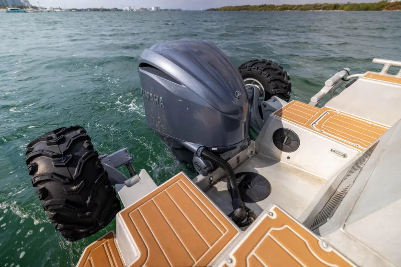 Slide: The Image of Amphibious Sealegs 8.5M boat with wheels and outboard motor on water, 2022 model. - 8