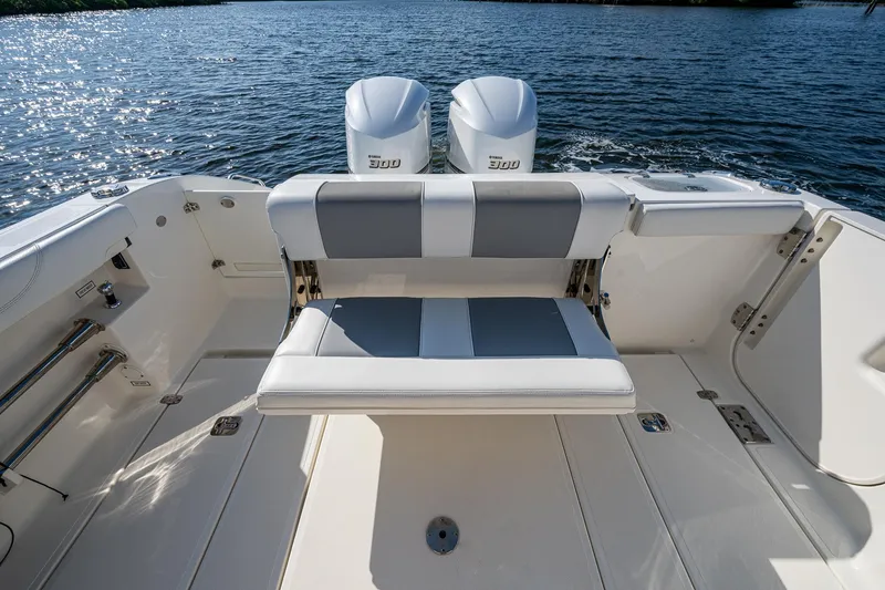 Slide: The Image of 2021 Pursuit S 288 Sport boat with dual engines and foldable seating on deck. - 34