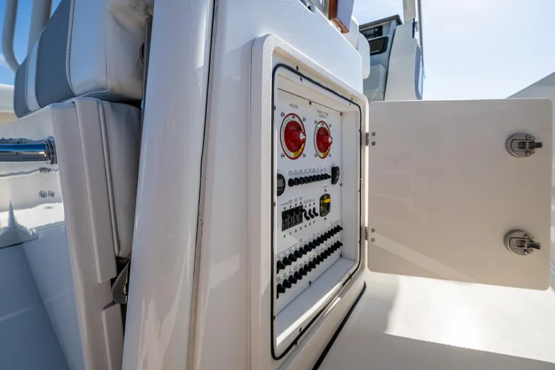 Slide: The Image of 2021 Pursuit S 288 Sport boat electrical panel with open access door. - 42