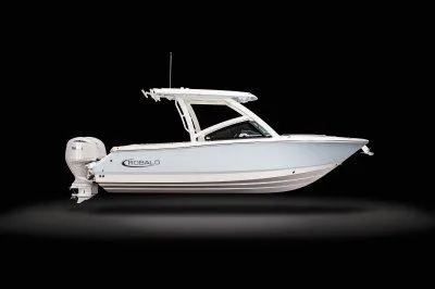 Slide: The Image of 2025 Robalo R257 DC boat, side view, sleek design, white hull, black background. - 1