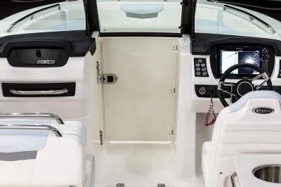 Slide: The Image of 2025 Robalo R257 DC boat interior with modern dashboard and steering wheel. - 11