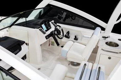 Slide: The Image of 2025 Robalo R257 DC boat interior with modern dashboard and seating. - 13