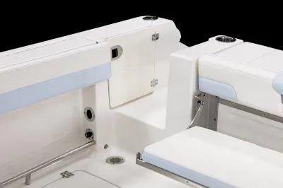Slide: The Image of 2025 Robalo R257 DC boat interior with white seating and storage compartments. - 25
