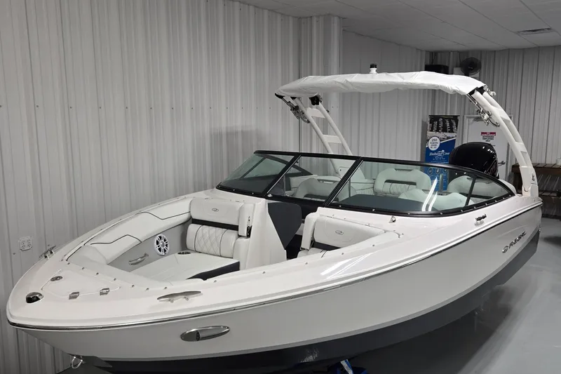 Slide: The Image of 2026 Regal LX2 boat in showroom, featuring sleek white design and modern interior. - 3