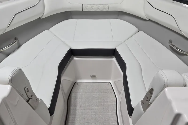 Slide: The Image of 2026 Regal LX2 boat interior with white cushioned seating and sleek design. - 6