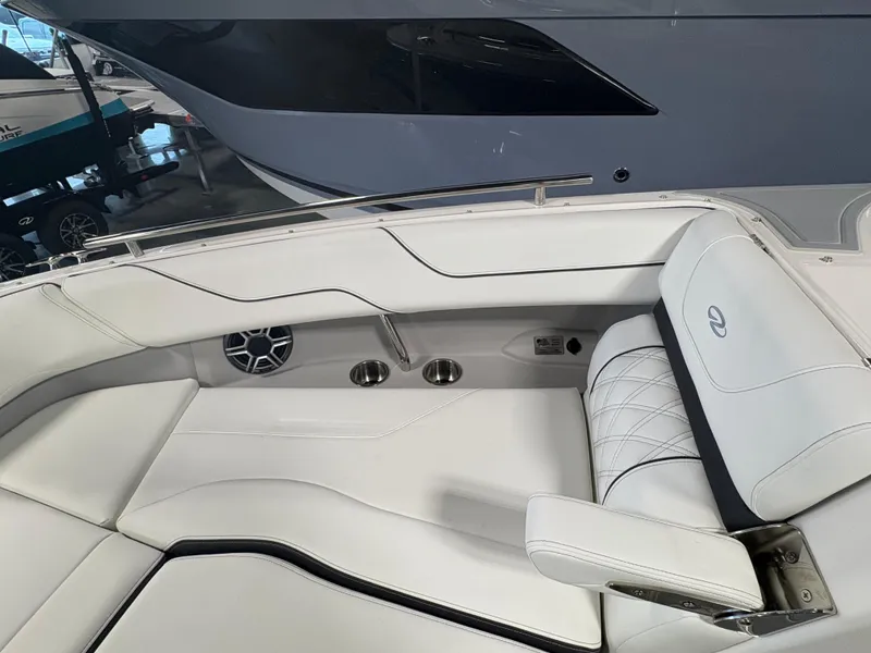 Slide: The Image of 2026 Regal LS6 Surf boat interior with white leather seating and speaker system. - 10