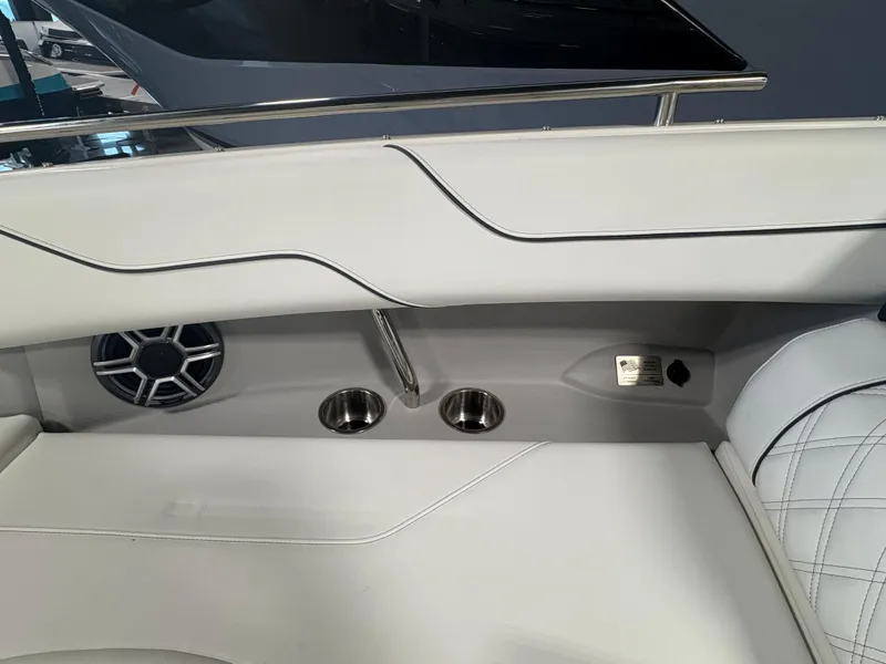 Slide: The Image of Interior of 2026 Regal LS6 Surf boat with speaker and cup holders. - 11