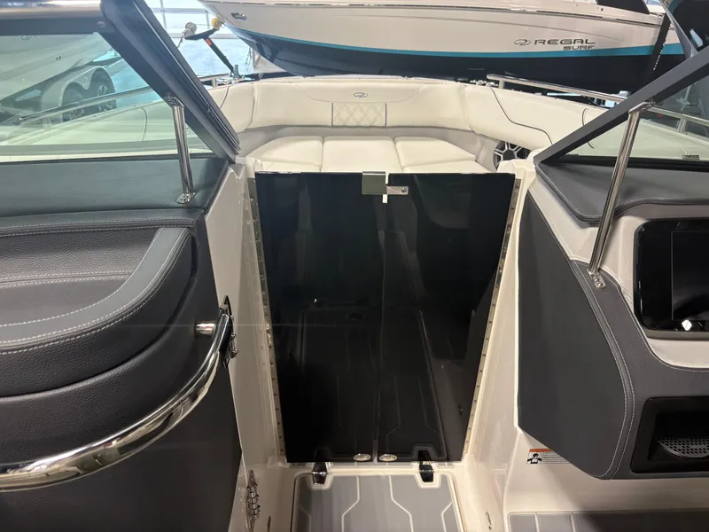 Slide: The Image of Interior view of 2026 Regal LS6 Surf boat, featuring sleek seating and modern design. - 13