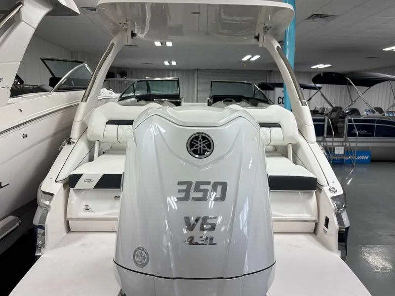 Slide: The Image of 2026 Regal LX6 boat with 350 V6 4.3L engine in showroom. - 13