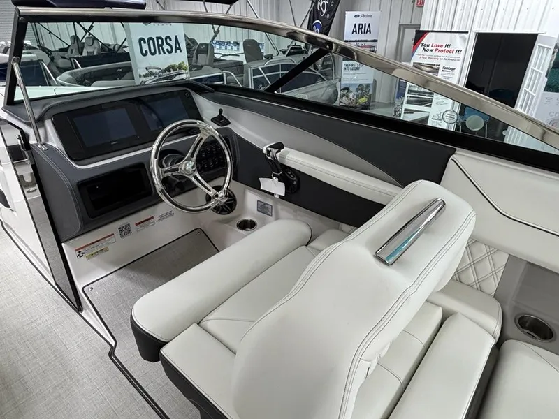 Slide: The Image of Interior of 2026 Regal LX6 boat with modern dashboard and white seating. - 23