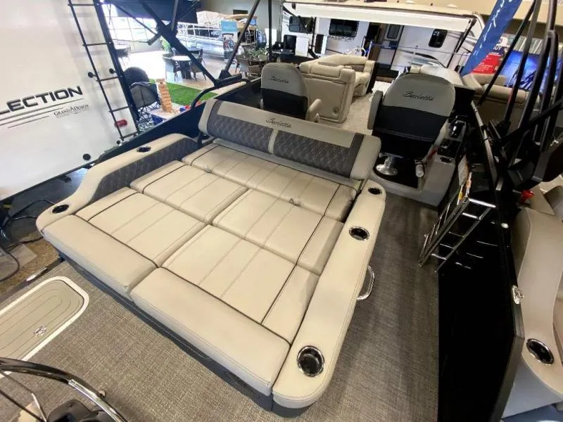 Slide: The Image of 2024 Lusso Ultra-Lounge 25UC boat interior with luxurious seating and cup holders. - 10