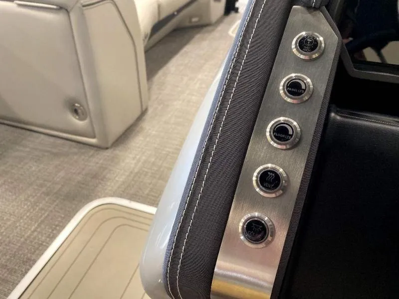 Slide: The Image of 2024 Lusso Ultra-Lounge 25UC interior control panel with buttons and luxurious seating. - 23