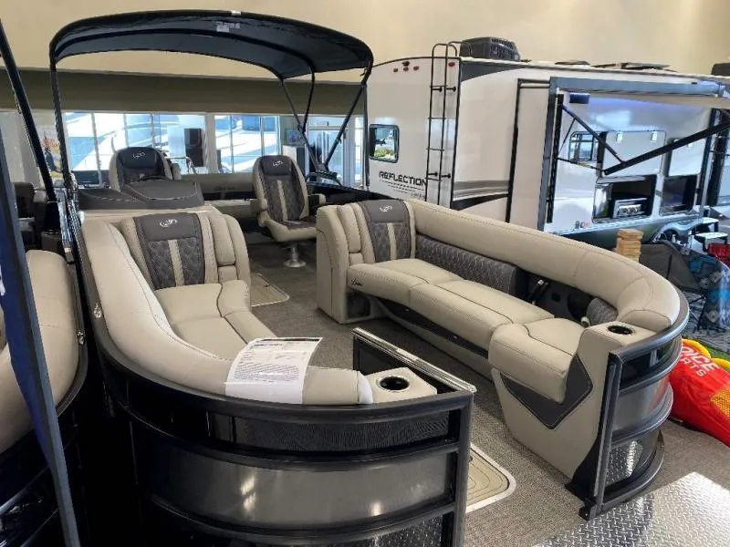 Slide: The Image of 2024 Lusso Ultra-Lounge 25UC pontoon boat with luxurious seating and modern design. - 3