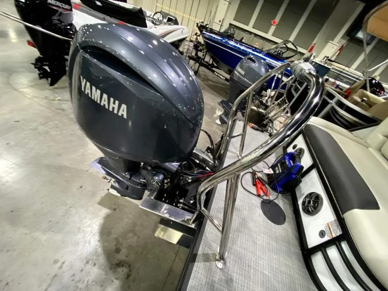 Slide: The Image of 2024 Geneva Cruise SB 22 boat with Yamaha outboard motor in showroom. - 21