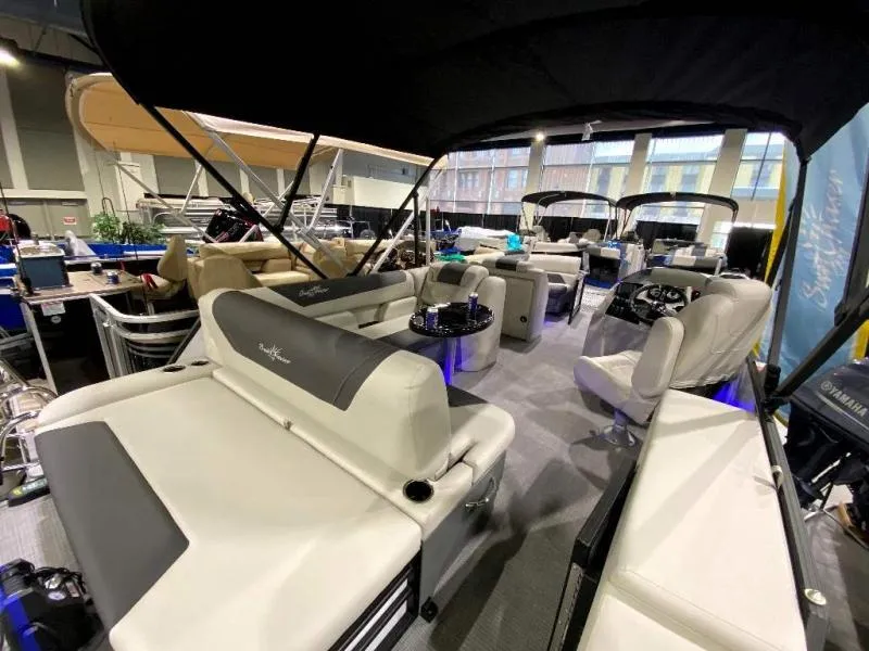 Slide: The Image of 2024 Geneva Cruise SB 22 pontoon boat interior with luxurious seating and modern design. - 5
