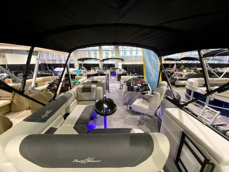 Slide: The Image of 2024 Geneva Cruise SB 22 pontoon boat interior with luxurious seating and modern design. - 8