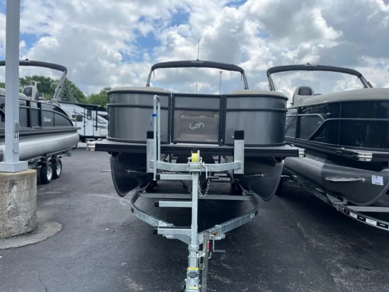 Slide: The Image of 2024 Aria Ultra-Lounge A22UC pontoon boat on trailer under cloudy sky. - 3