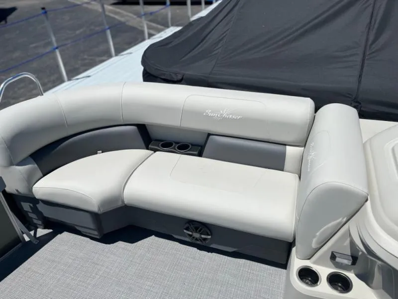Slide: The Image of 2024 Vista 20 LR boat with white cushioned seating and cup holders. - 5