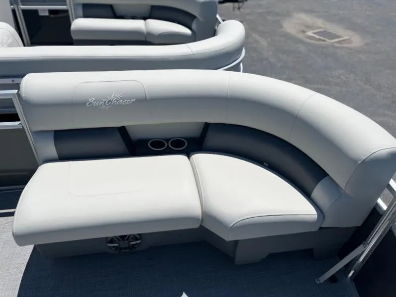 Slide: The Image of Luxurious seating on 2024 Vista 20 LR boat, featuring plush white upholstery and cup holders. - 6