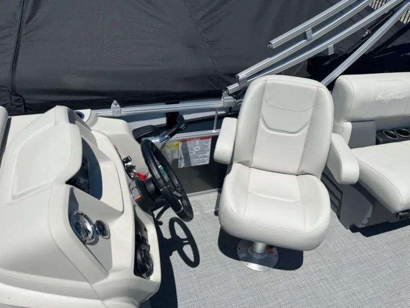 Slide: The Image of 2024 Vista 20 LR boat interior with white captain's chair and steering console. - 8
