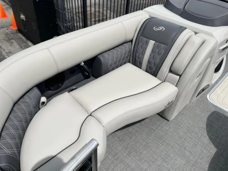 Slide: The Image of 2024 Lusso Ultra-Lounge L23UC boat interior with luxurious seating and elegant design. - 5