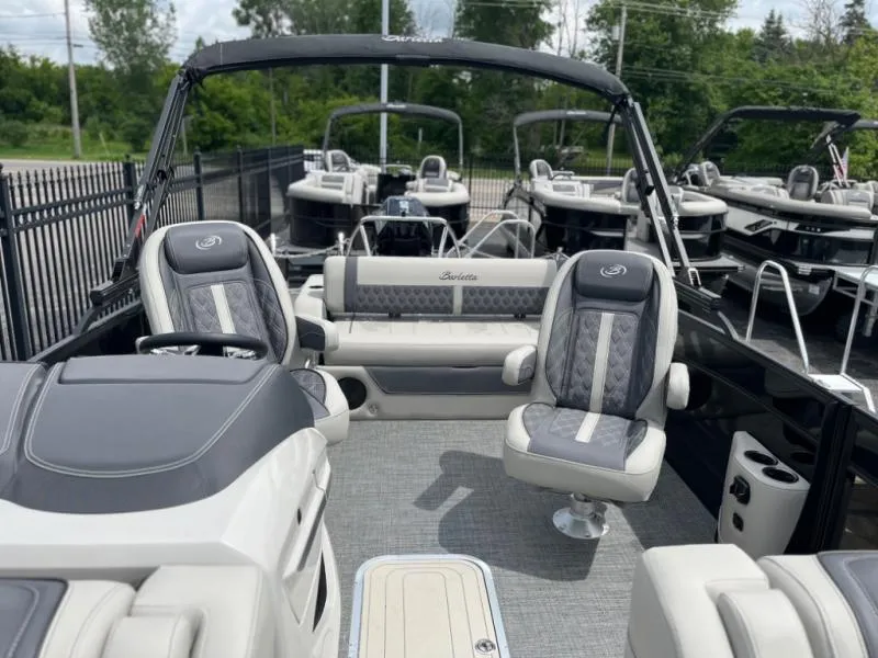 Slide: The Image of 2024 Lusso Ultra-Lounge L23UC boat interior with luxurious seating and modern design. - 7
