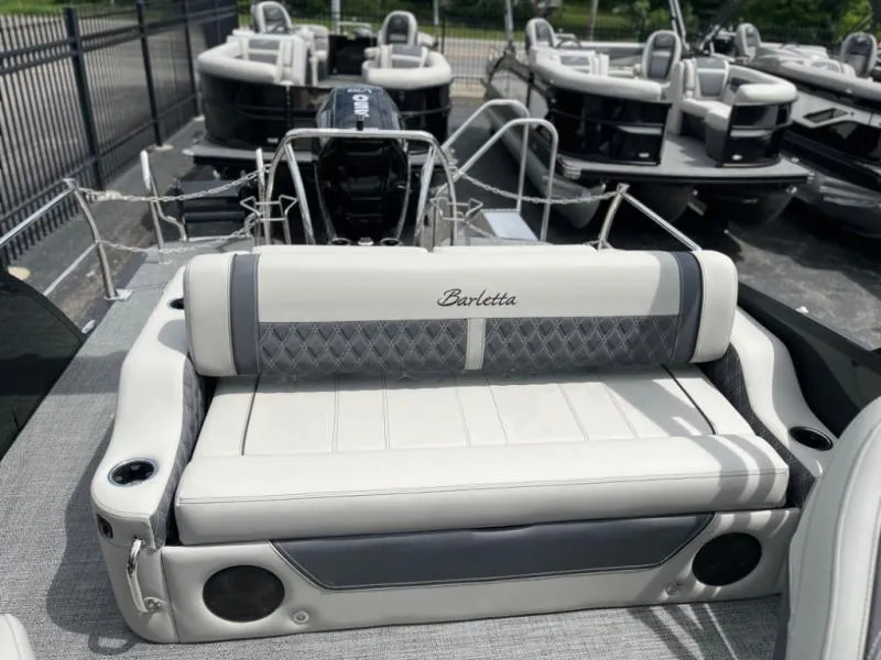 Slide: The Image of 2024 Lusso Ultra-Lounge L23UC pontoon boat with luxurious seating and modern design. - 9