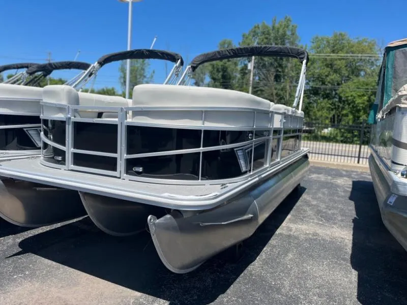 Slide: The Image of 2024 Vista 20 LR pontoon boat with sleek design, parked outdoors. - 4