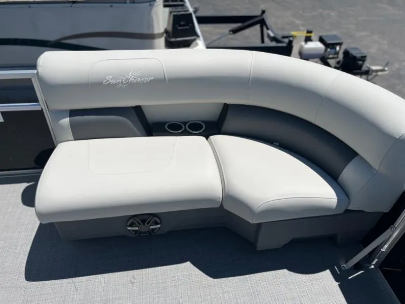 Slide: The Image of 2024 Vista 20 LR boat with white cushioned seating and cup holders. - 7