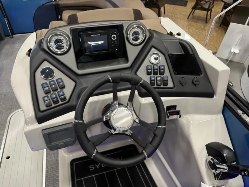 Slide: The Image of 2025 L3 DLZ Bar boat dashboard with steering wheel, controls, and display screen. - 13