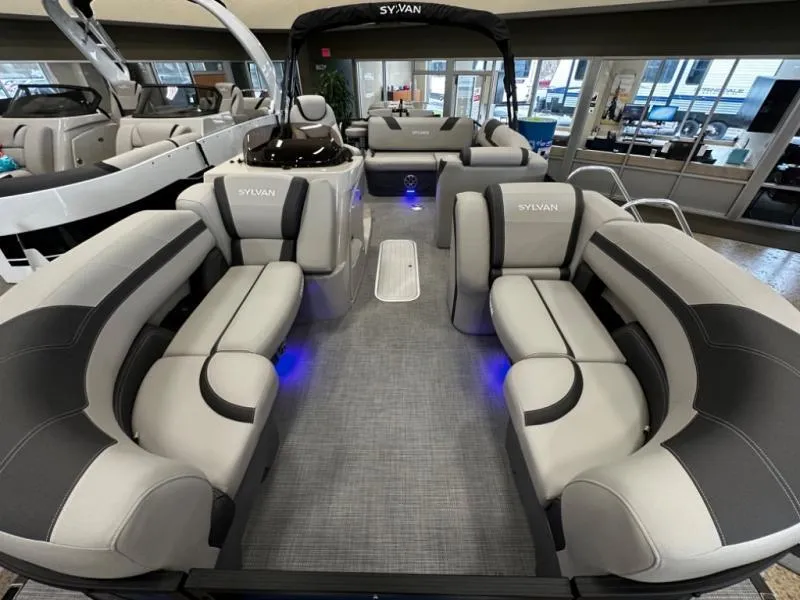 Slide: The Image of Luxurious 2025 L3 DLZ Bar pontoon boat interior with plush seating and ambient lighting. - 7