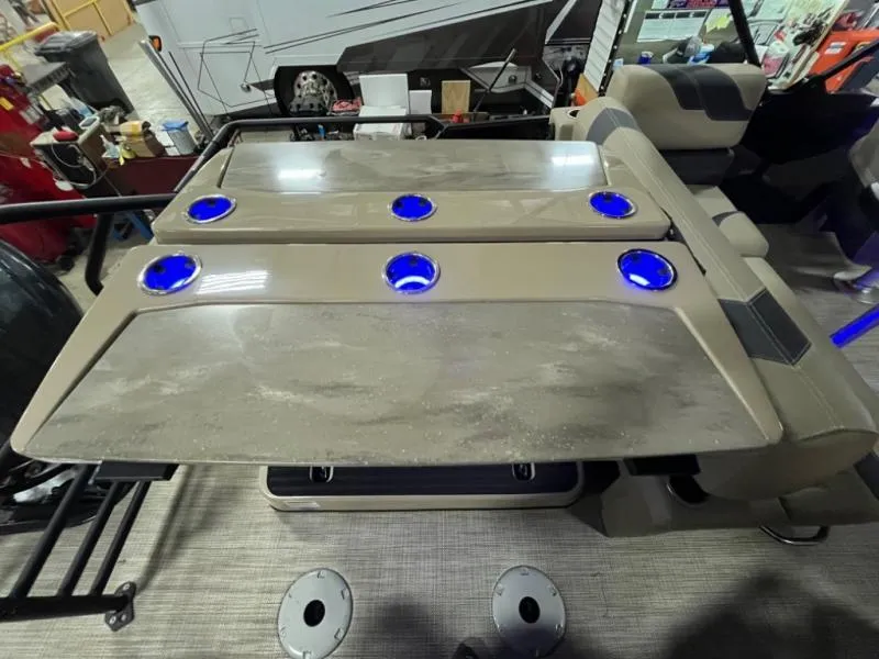 Slide: The Image of Modern L3 DLZ DH Bar 2025 with illuminated cup holders in a recreational vehicle setting. - 14