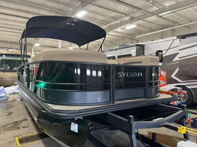 Slide: The Image of 2025 L3 DLZ DH Bar pontoon boat in a storage facility. - 3