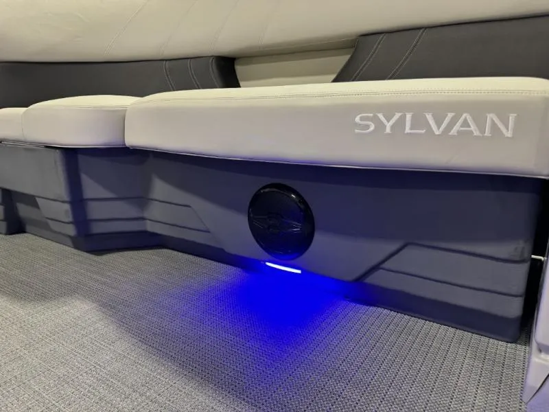 Slide: The Image of 2025 Mirage Cruise 8520 CRS boat interior with Sylvan seating and blue LED lighting. - 15