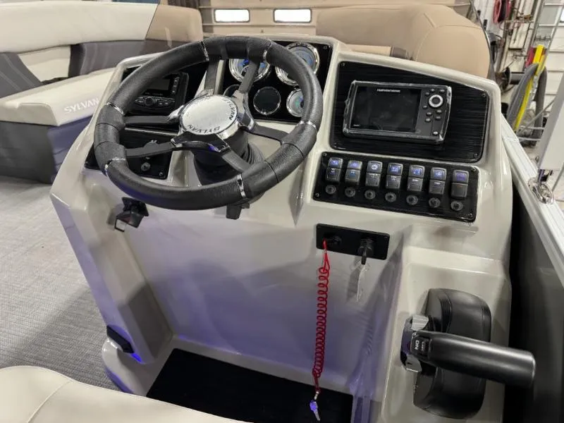 Slide: The Image of 2025 Mirage Cruise 8520 CRS boat dashboard with steering wheel and control panel. - 17