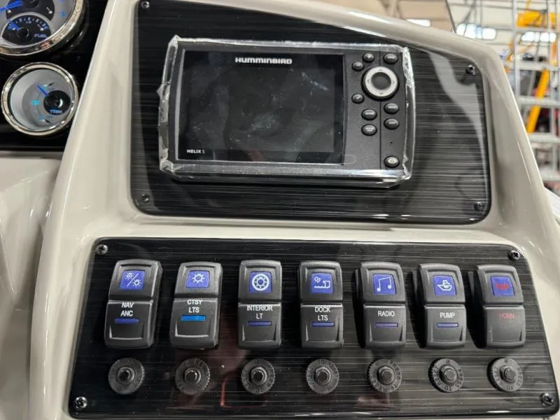 Slide: The Image of Control panel of 2025 Mirage Cruise 8520 CRS with navigation and lighting switches. - 20