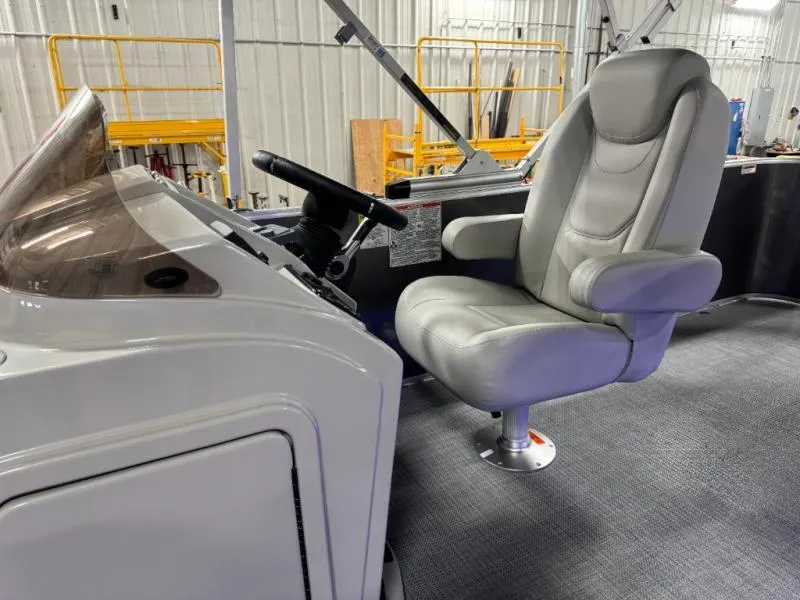 Slide: The Image of Captain's chair and helm of 2025 Mirage Cruise 8520 CRS boat in a workshop. - 21