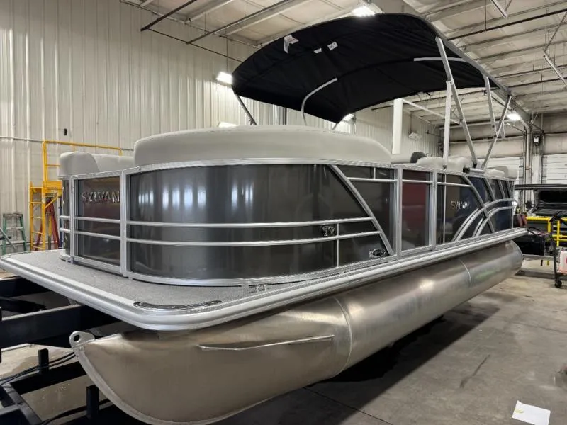 Slide: The Image of 2025 Mirage Cruise 8520 CRS pontoon boat in a warehouse setting. - 3