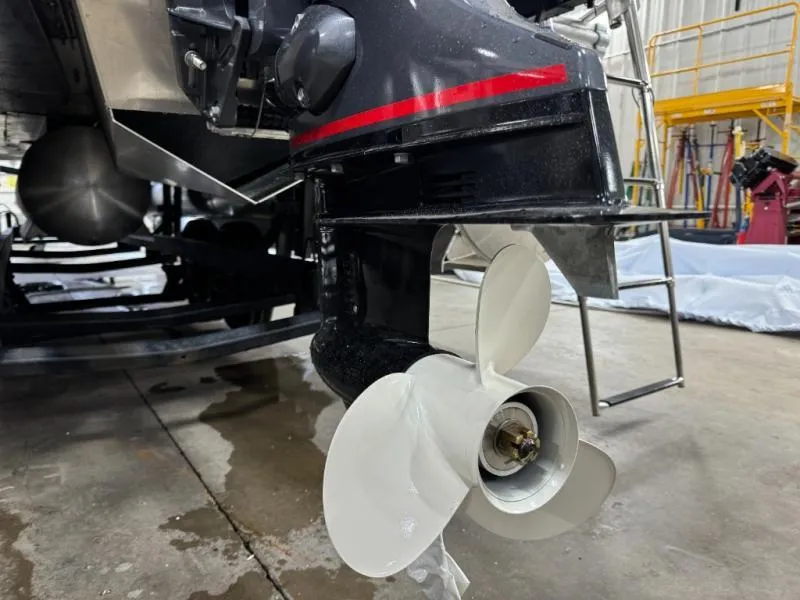 Slide: The Image of Close-up of a 2025 Mirage Cruise 8520 CRS boat propeller in a workshop setting. - 7