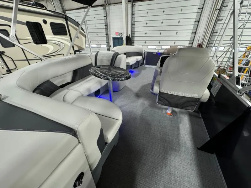 Slide: The Image of Luxurious interior of 2025 Mirage Cruise 8520 CRS pontoon boat with plush seating and ambient lighting. - 9