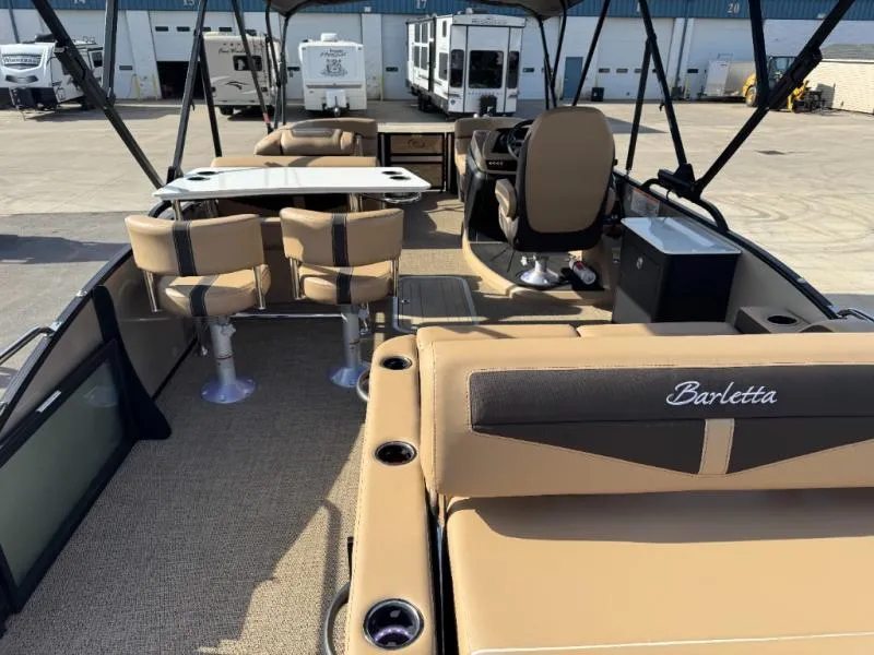 Slide: The Image of Interior of 2025 Cabrio Ultra-Entertainer C24UE boat with seating and table. - 14