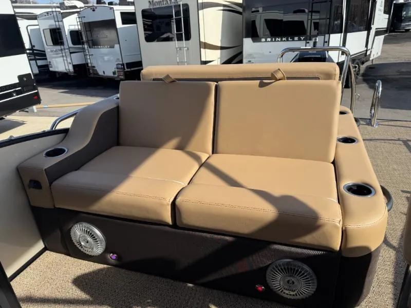 Slide: The Image of Luxurious seating on 2025 Cabrio Ultra-Entertainer C24UE boat, featuring cup holders and speakers. - 18