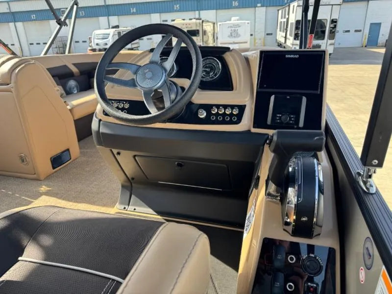 Slide: The Image of Interior of 2025 Cabrio Ultra-Entertainer C24UE boat with modern dashboard and controls. - 22